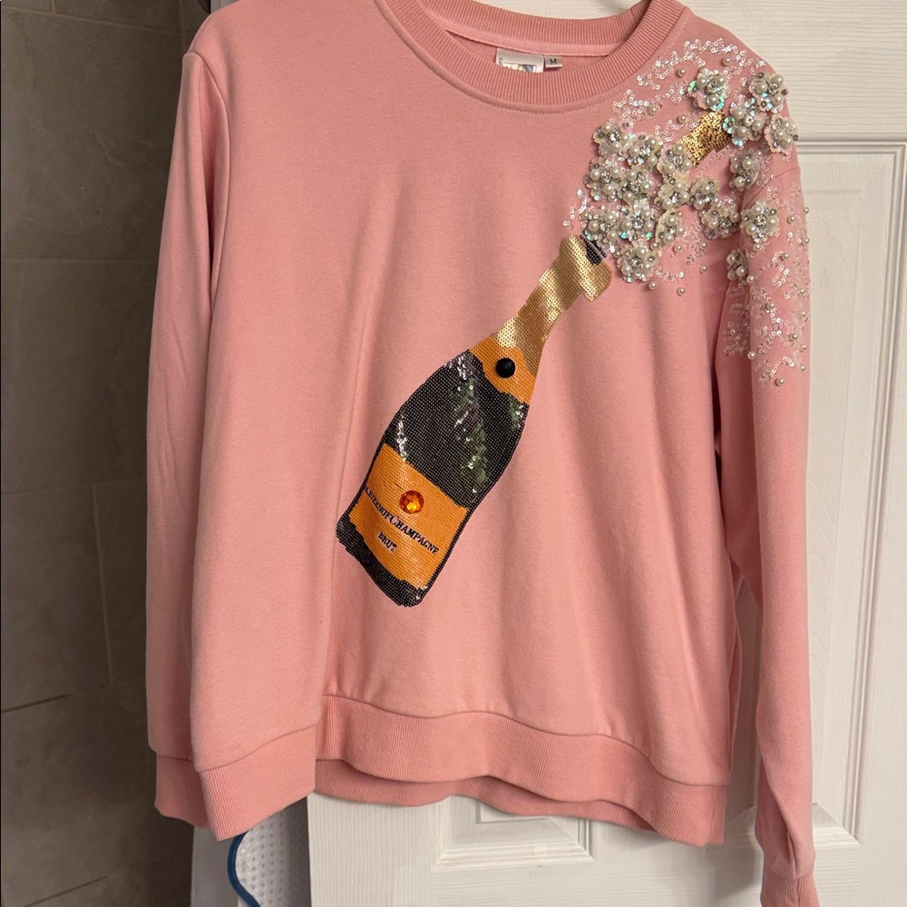 QUEEN OF SPARKLES Pink Champagne Sequin Sweatshirt
